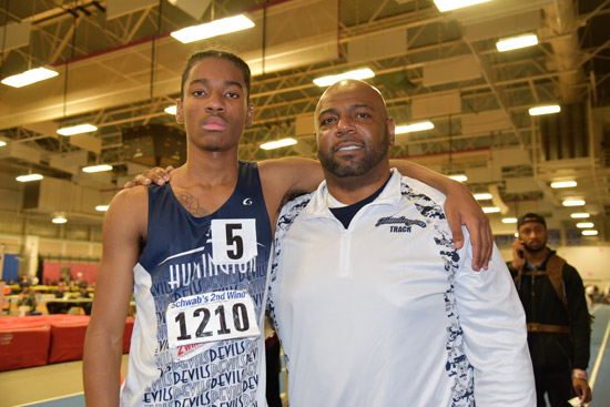 Huntington junior Jonathan Smith with Blue Devil track head coach Ronald Wilson.
