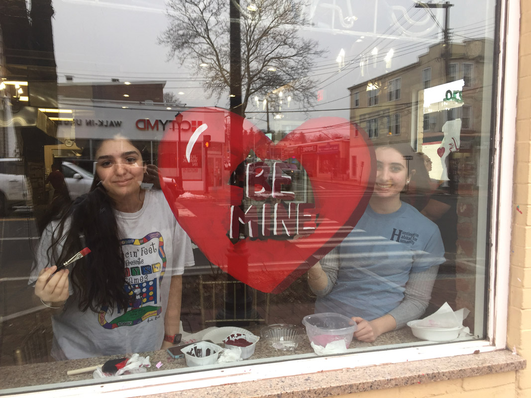 Huntington Art Honor Society members painted the windows at Rosa's Pizzeria for Valentine's Day.