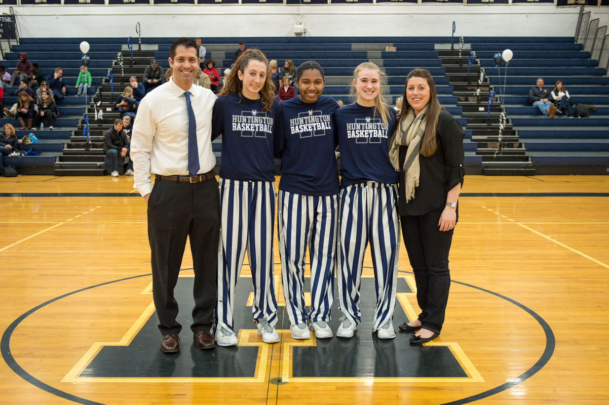 Huntington seniors Alexandra Heuwetter, Nicole Leslie and Katie Seccafico with coaches Mike Kaplan and Marissa Bergmann. (Darin Reed photo.)