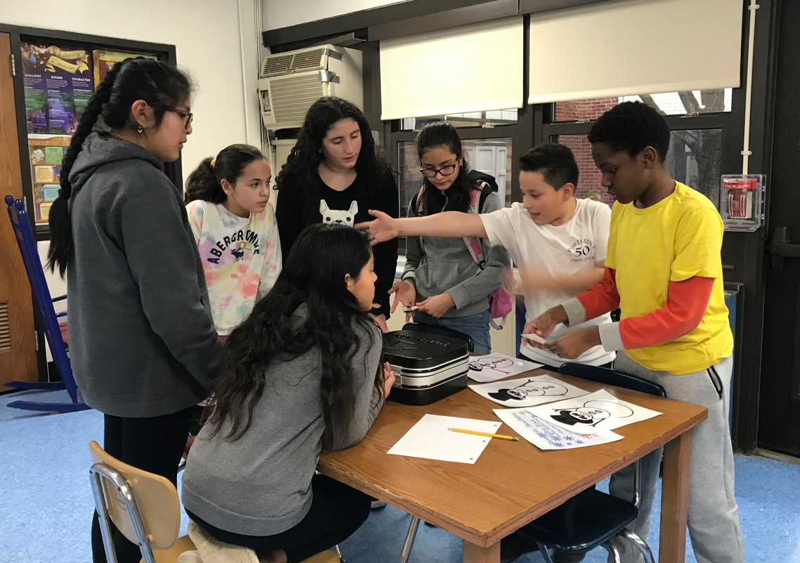 The Woodhull School library sprang to life for sixth graders involved in a breakout competition. 
