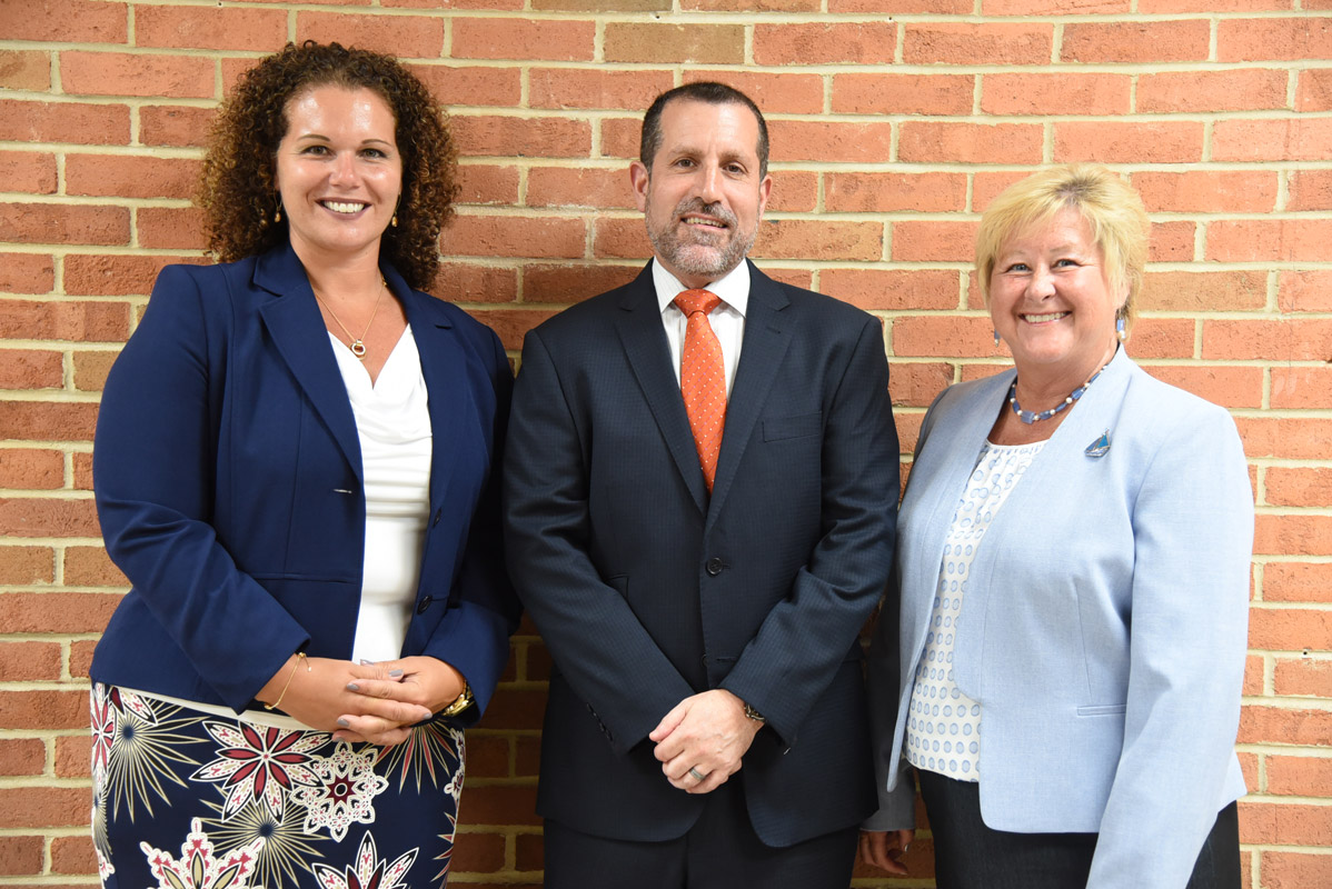 Superintendent James W. Polansky is flanked by Assistant Superintendents Beth McCoy and Kathleeen Acker. 