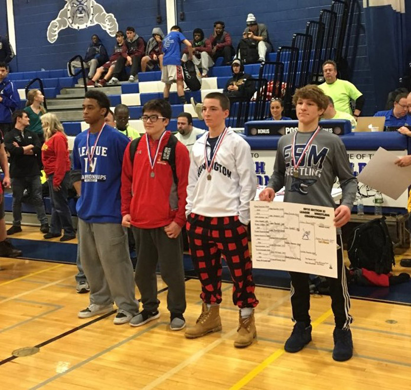 Huntington sophomore Aedan McDonald (second from left) placed third in the league tournament last weekend.