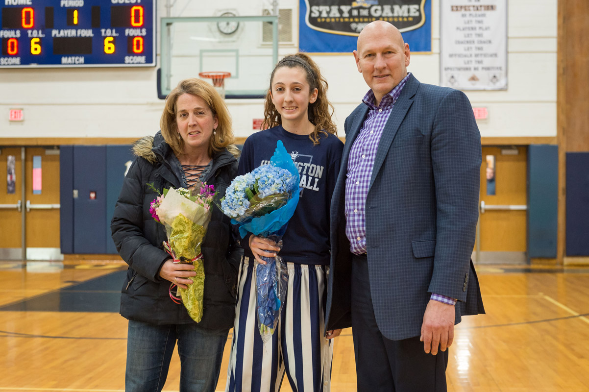 Huntington senior Alex Heuwetter flanked by her parents, Mark and Karen.