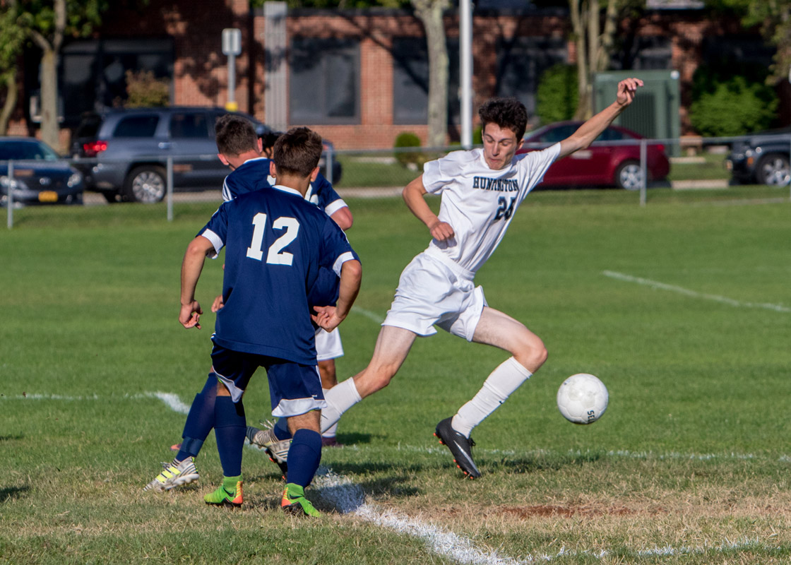 Huntington senior Aidan Forbes (right) in action for the Blue Devils. (Mike Connell photo.)