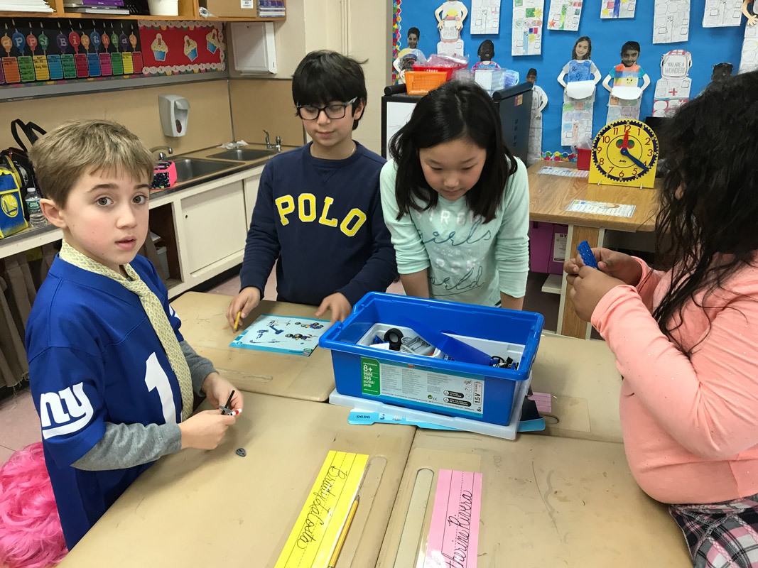Blue-bin activities keep these Flower Hill third graders on the go intellectually. 