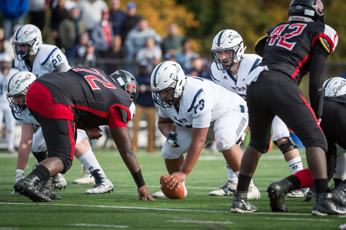 Clay Jamison is set to snap the ball during a playoff game last fall. (Darin Reed photo.)