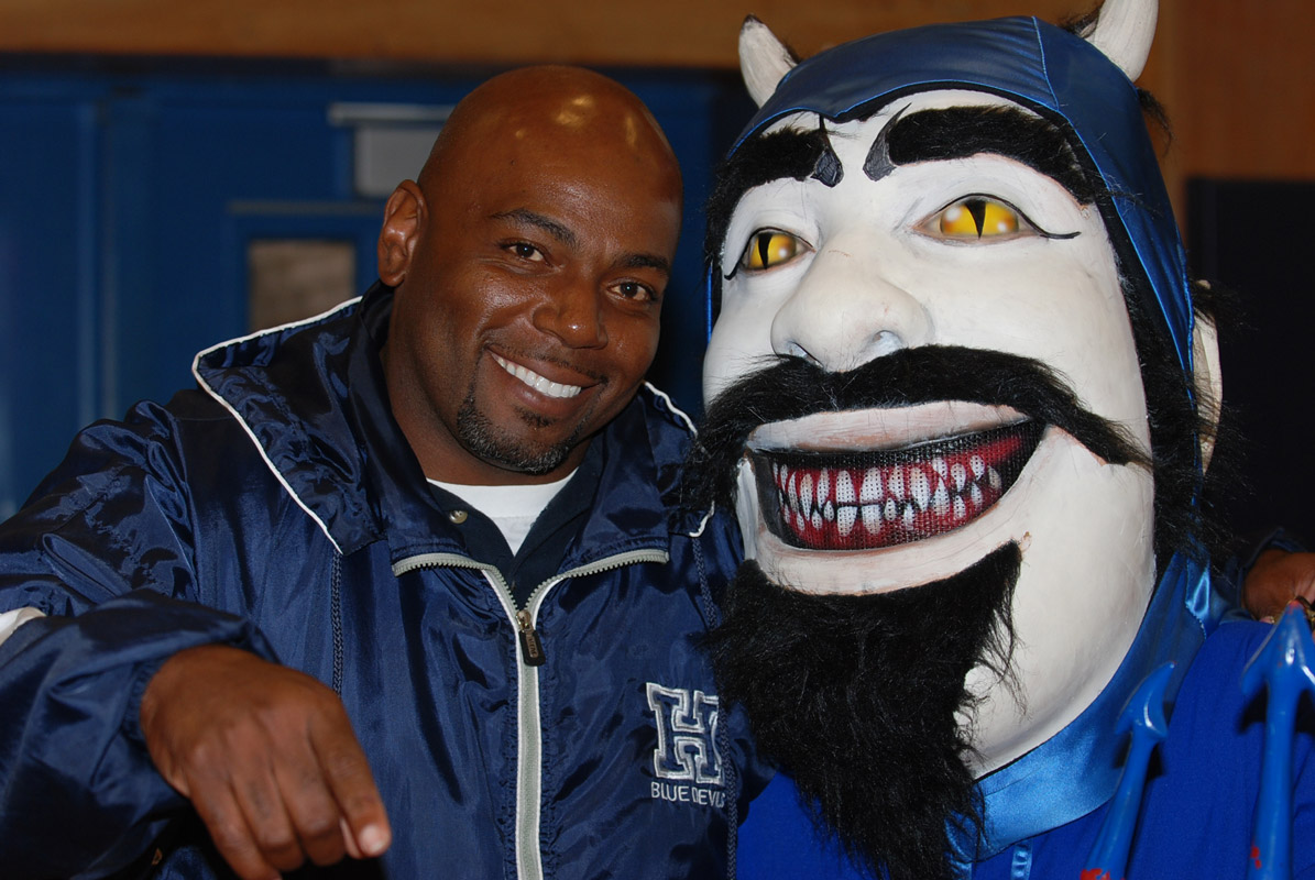 Huntington track coach Ron Wilson was a happy Blue Devil at the county championships.