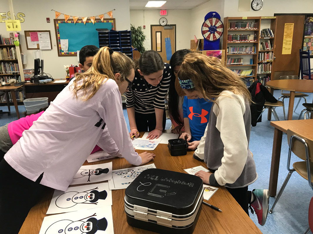 The Woodhull School library sprang to life for sixth graders involved in a breakout competition. 