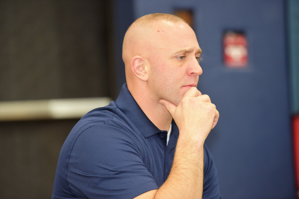 Huntington wrestling first year head coach Louis R. Giani surveys the scene