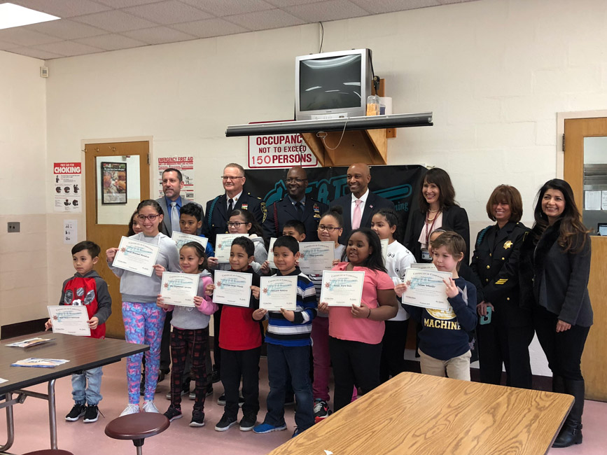 Flower Hill fourth graders with assorted school, district and county dignitaries.