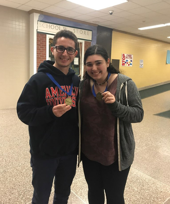 Huntington seniors Noah Morris and Rachel Moss with their Science Olympiad medals. 
