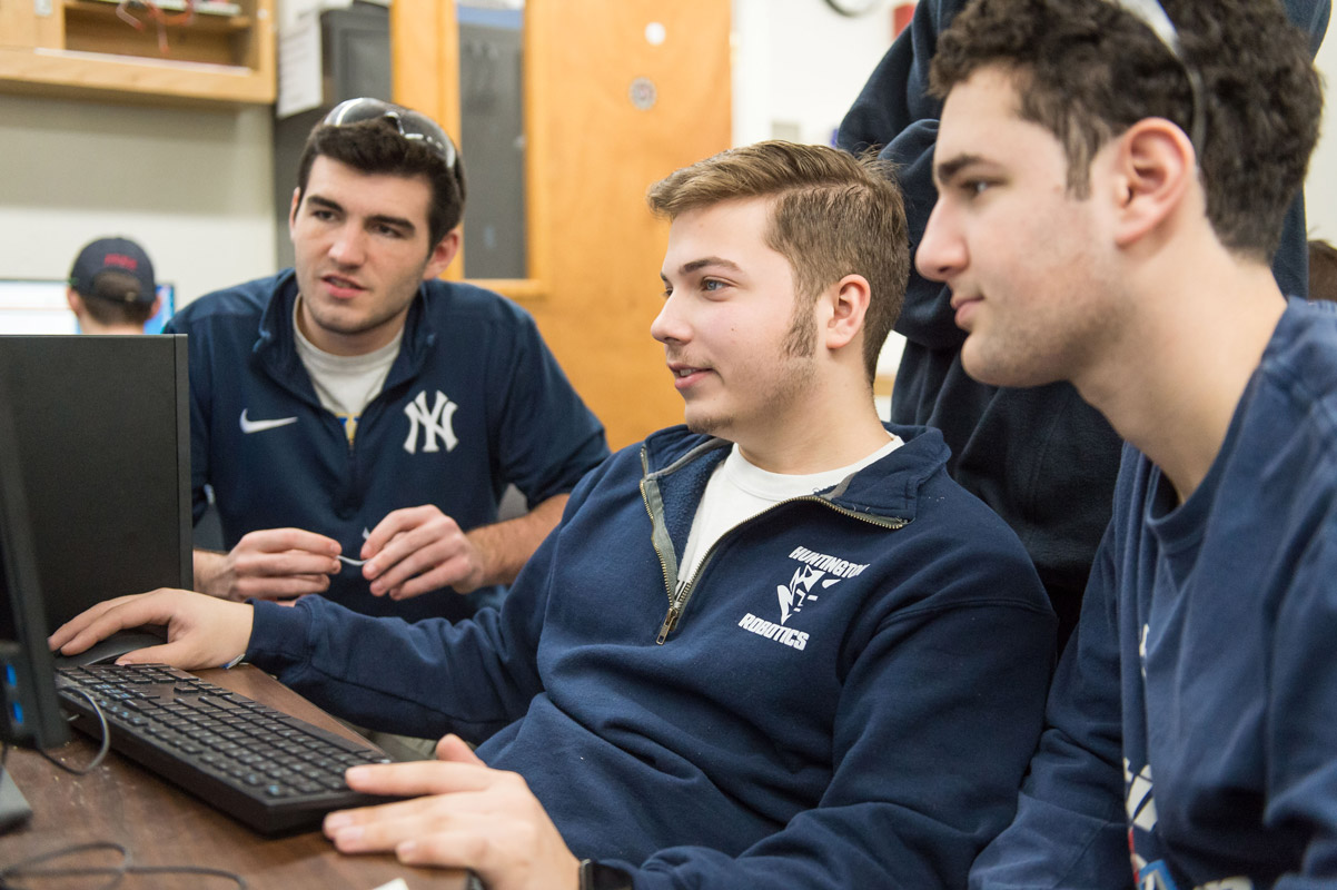 The Huntington robotics team is busy building and programming its robot for competition. (Darin Reed photo.)
