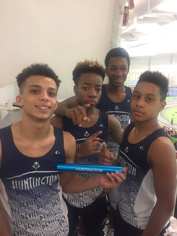 Huntington's first place relay team with the race baton.