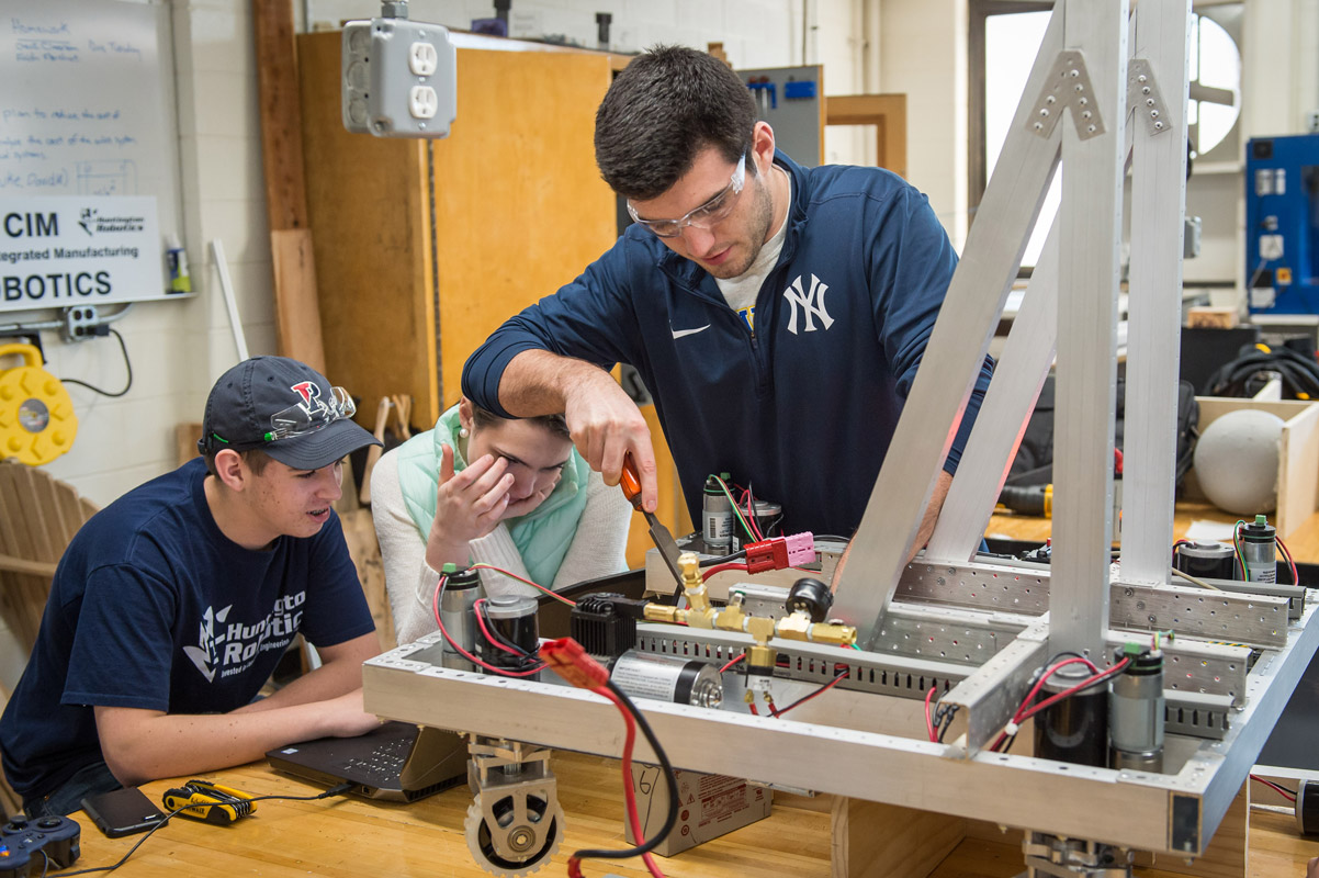 The Huntington robotics team is busy building and programming its robot for competition. (Darin Reed photo.)