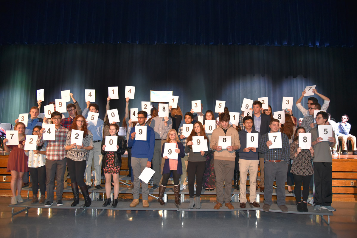 The inductees posed a problem for the audience. Asst. Principal Gamal Smith provided the correct answer. 
