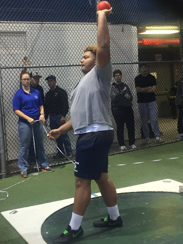 Huntington senior Clay Jamison preps to throw the shot put.