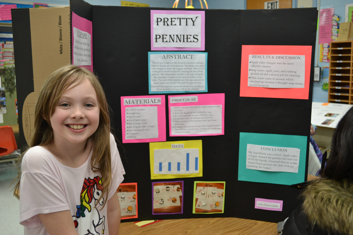 Sofia Van Arsdale sure is proud of her Science Fair project.