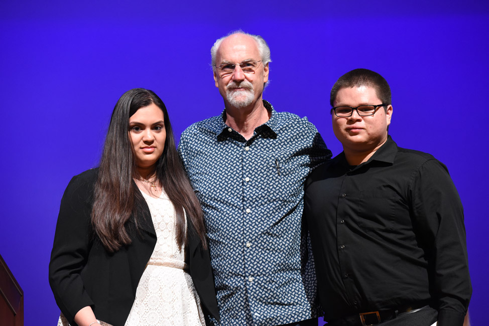 Scott DeGelleke (center) presented the 2018 October Dawn Scholarship to Cindy Ortiz and Joel Alfaro