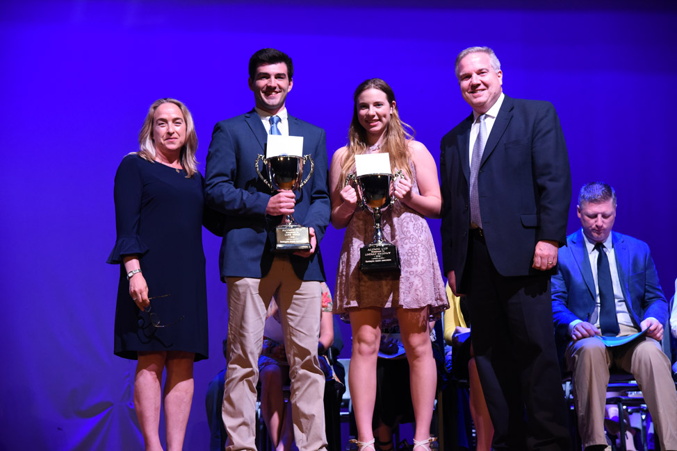 Alumni Cup recipients Luke Eidle and Lindsay Saginaw with HAA executive board members Emily Rogan and Tom DiGiacomo 