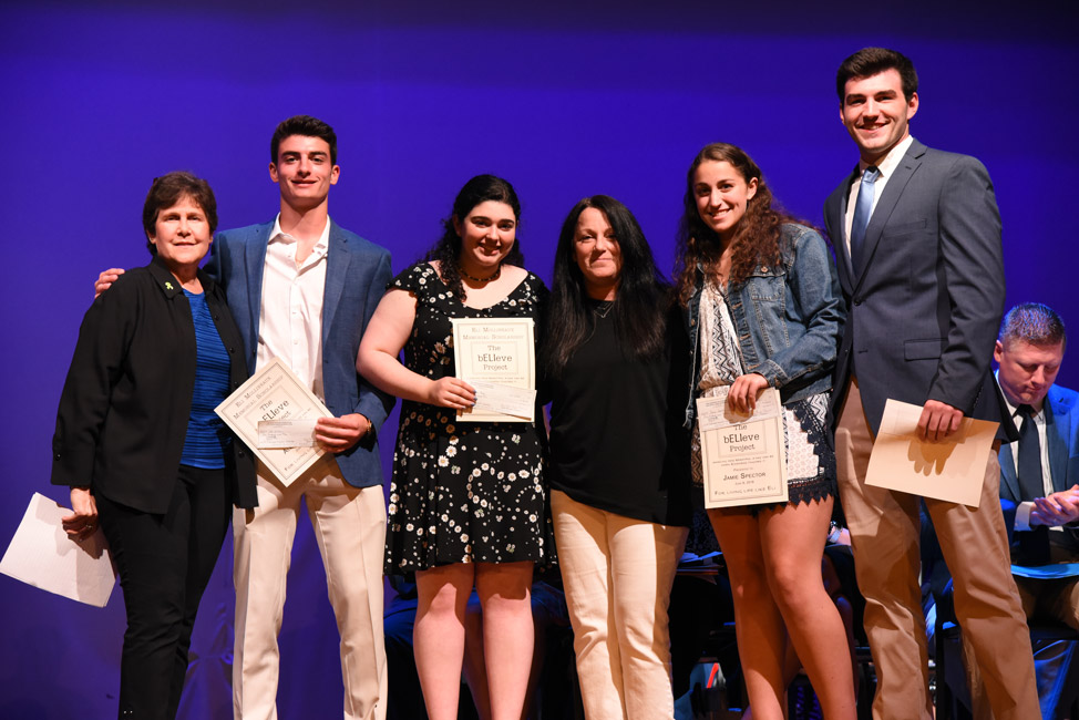 Ilene Messina (left) and Ellen Mollineaux (third from right) with the four 2018 bELIeve Project scholarship recipients 