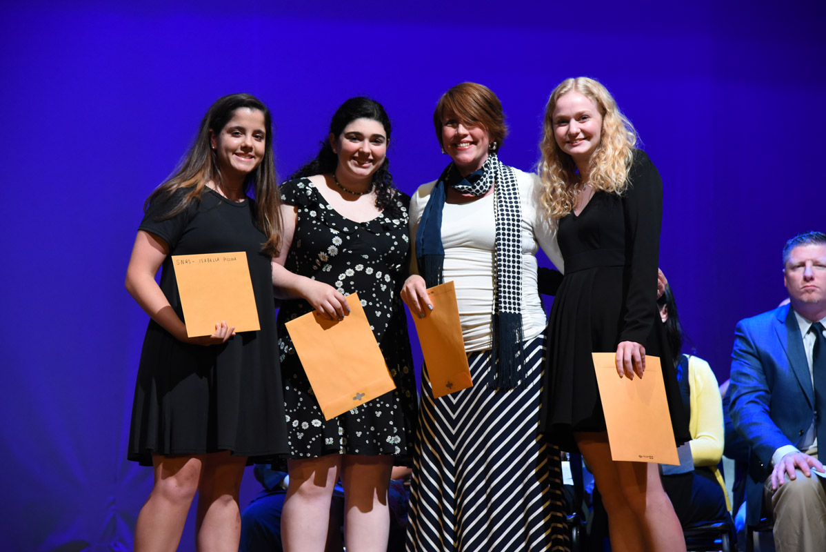 Director of STEM Jill Johanson presented Isabella Piccola, Rachel Moss and Amelia Reilly with Science Honor Society awards  