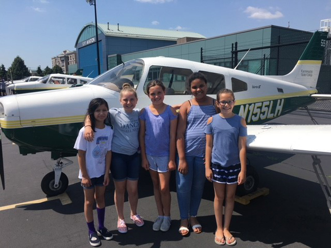 Huntington STEM Summer Academy participants at Farmingdale State College's Aviation Flight Center