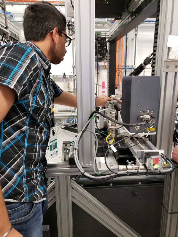 Huntington students Ryan Hoffmann and Arashdeep Singh and teacher Dame Forbes trained at Brookhaven National Lab last week 