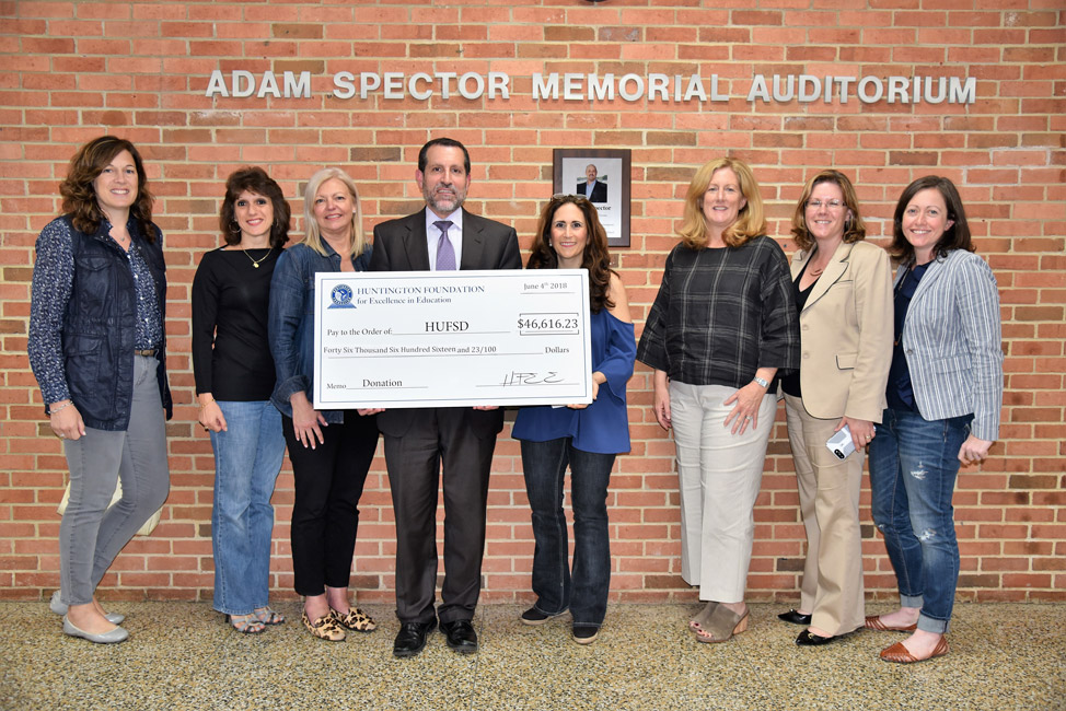 Supt. Jim Polansky and HFEE President Alice Marie Rorke hold a ceremonial check.