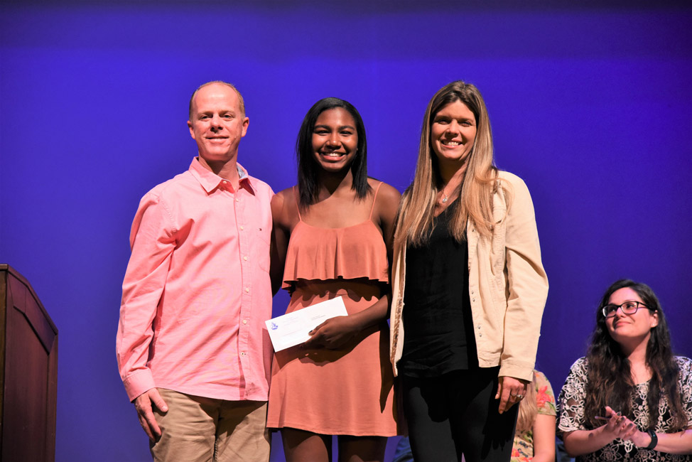 Huntington senior Nicole Leslie with members of Kurt Schaefer's family at the scholarship presentation 