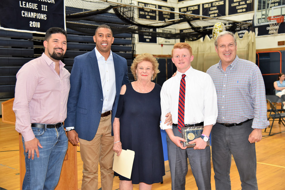 Colby Martin (second from right) with Huntington lacrosse coaches and Cambria family members 