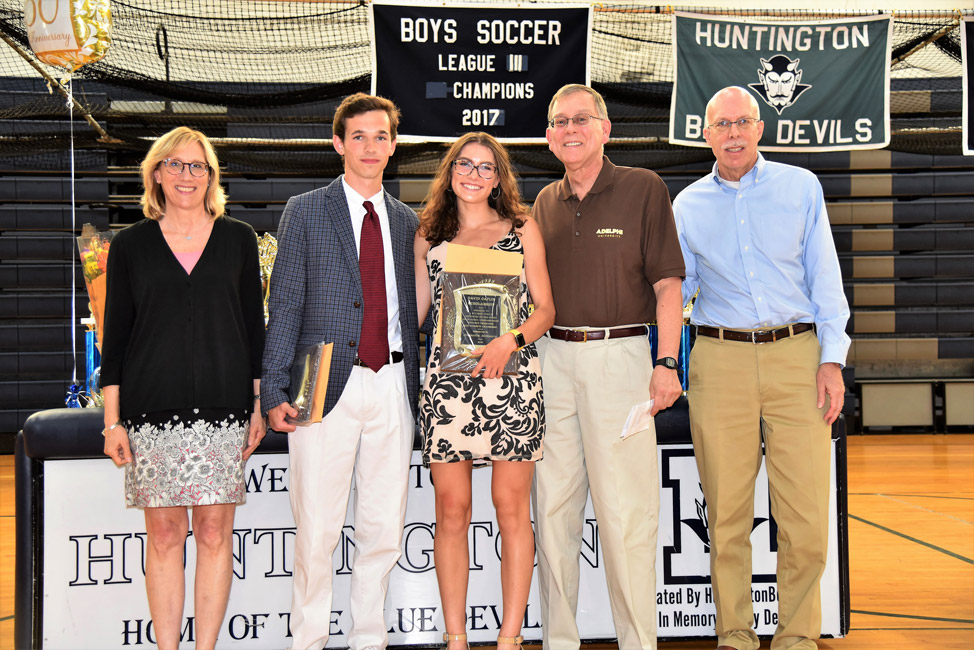 David Caplin Scholarship Award recipients Michael Drake and Alexandra McKenzie with Huntington Class of 1974 members