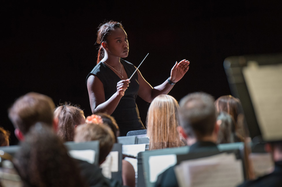 Huntington senior Mardnie Mentor directed the symphonic band at the high school's spring concert 