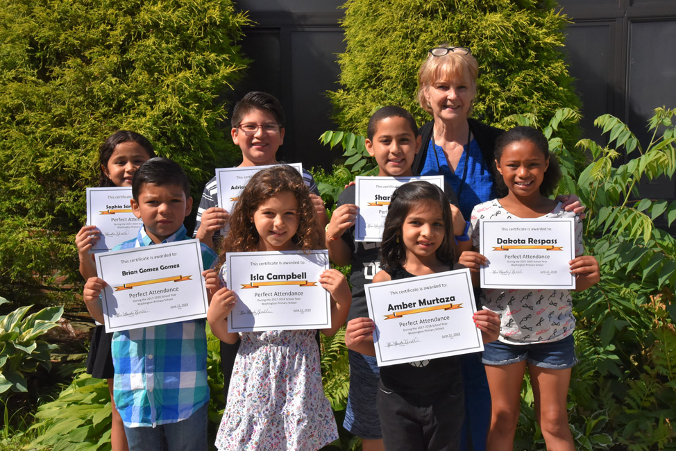 Washington Principal Marsha Neville with the seven Perfect Attendance Award honorees