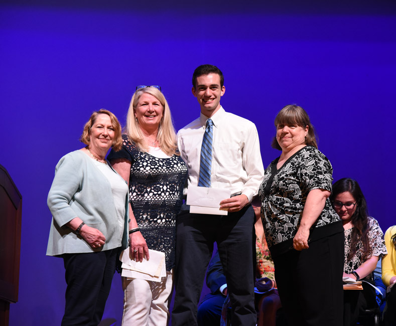 Huntington Class of 1968 members presented a scholarship to senior John Healy