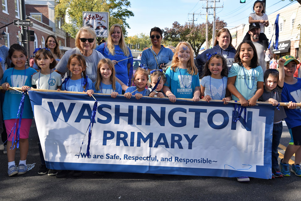 Marsha Neville (standing left) in the Homecoming Day parade.