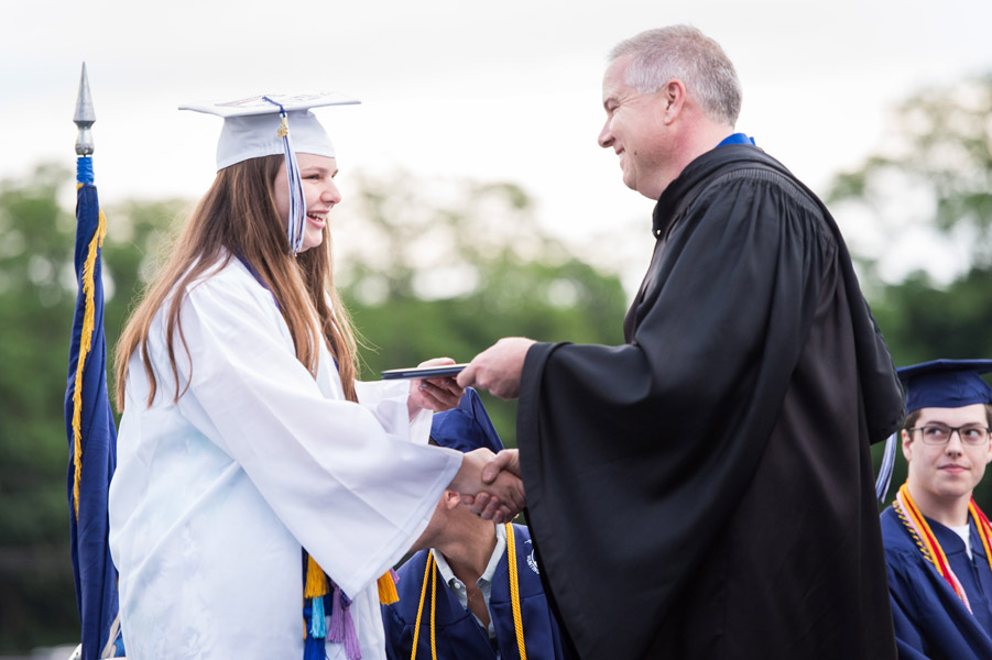 Huntington School Board President Thomas DiGiacomo was among those presenting diplomas. (Darin Reed photo.)
