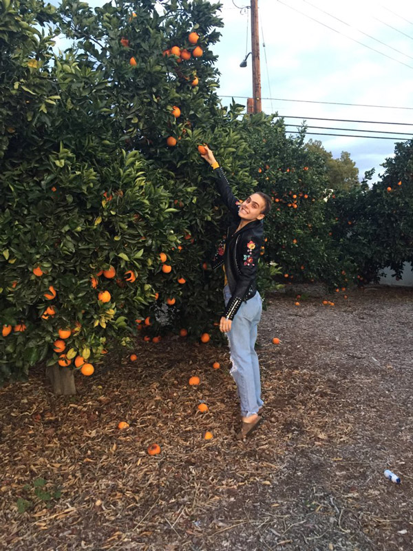 Christina Nigro in the orange grove on the University of Redlands campus..