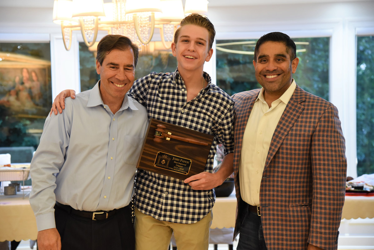John Panos (center with legal advisors John LoTurco and Xavier Palacios) won the Most Improved Litigator Award..