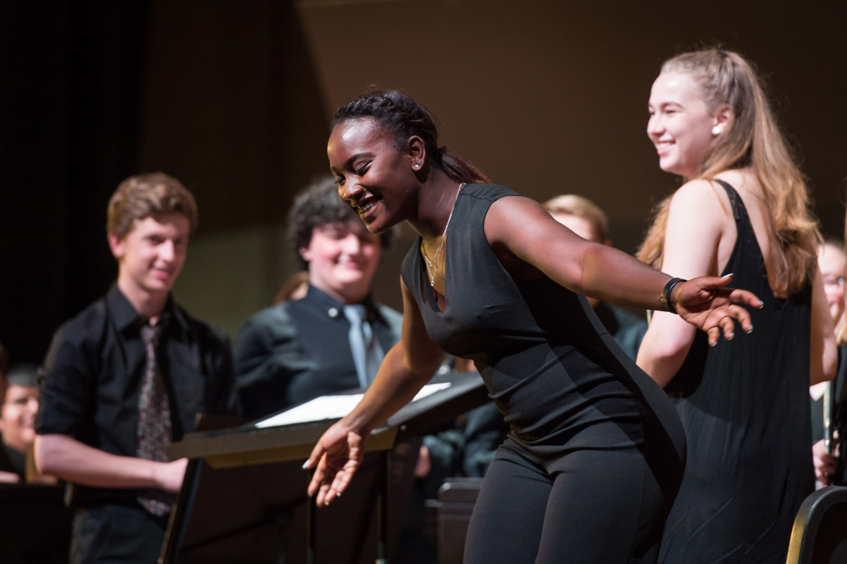 Huntington senior Mardnie Mentor directed the symphonic band at the high school's spring concert 