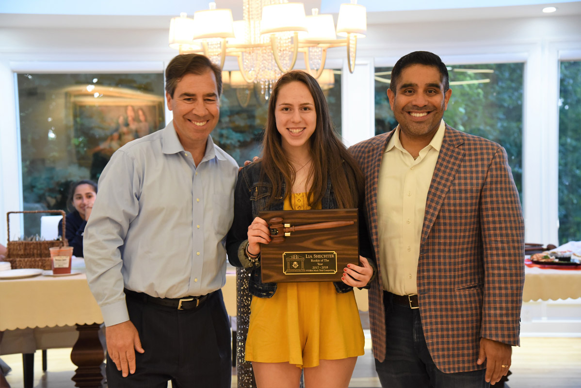 Legal advisors John LoTurco and Xavier Palacios with the Huntington mock trial team's Rookie of the Year Lia Shechter.