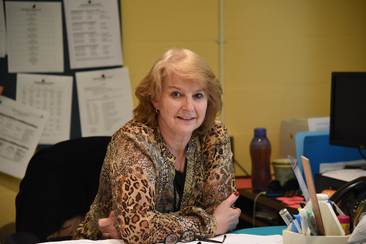 Marsha Neville behind the principal's desk at Washington Primary School. 