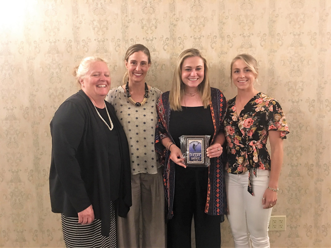 All-Division player Sarah Agrillo with the Blue Devil coaching staff.