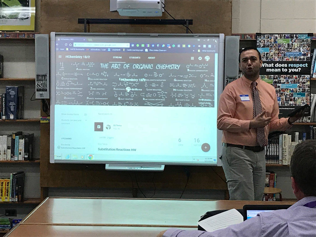 Huntington High School science teacher Ed Florea makes a presentation at the tech showcase.