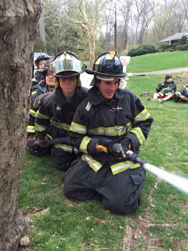 plaRocco Meagher (front) trains with the Halesite Fire Department.ce
