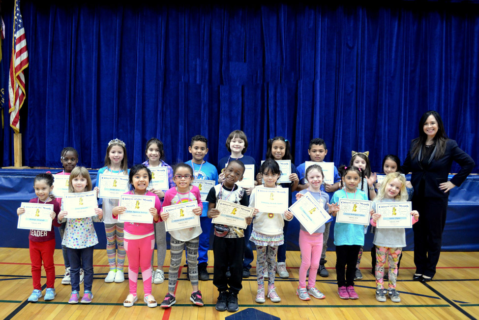 Jefferson Principal Valerie Capitulo-Saide with February's Citizens of the Month.