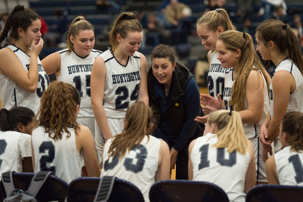Huntington huddles around assistant coach Marissa Bergmann. (Darin Reed photo (2)
