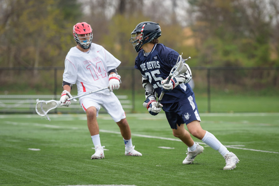 Fred Amato (right) goes one on one last spring. (Darin Reed photo.)