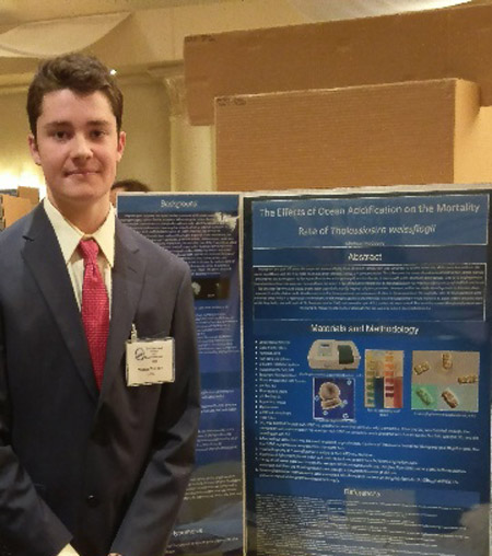Michael McCooey with his project at the LI Science & Engineering Fair.