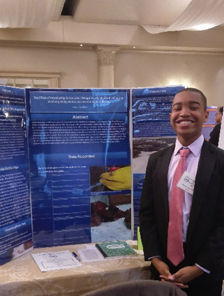 Robert Jean-Gilles with his project at the Crest Hollow.