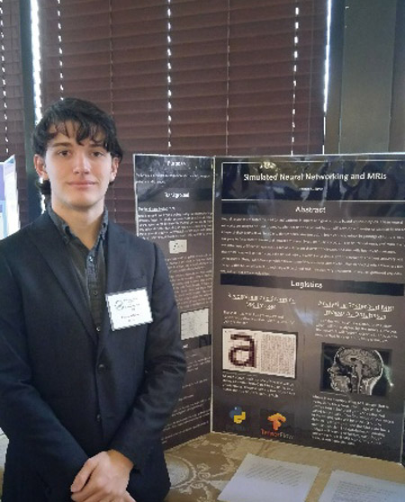 Foster Sullivan with his project at the LI Science & Engineering Fair.